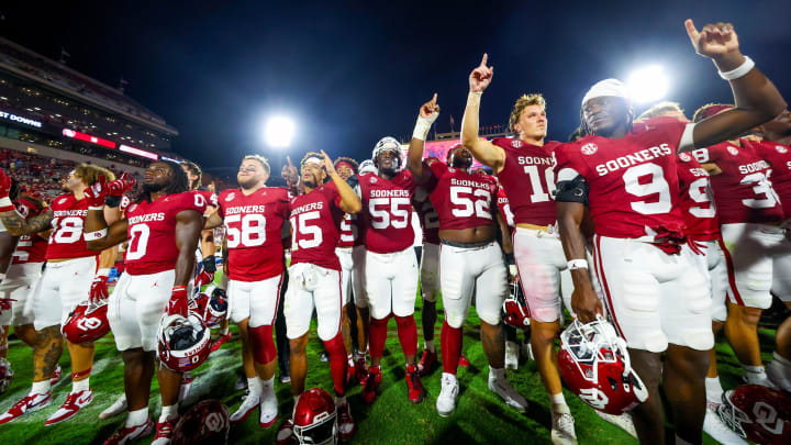 Aug 30, 2024; Norman, Oklahoma, USA;  Oklahoma Sooners players celebrate after the game against the Temple Owls at Gaylord Family-Oklahoma Memorial Stadium.