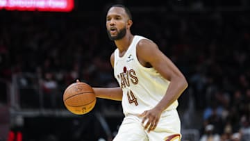 Nov 29, 2024; Atlanta, Georgia, USA; Cleveland Cavaliers forward Evan Mobley (4) dribbles the ball in the game against the Cleveland Cavaliers during the fourth quarter at State Farm Arena. Mandatory Credit: Jordan Godfree-Imagn Images