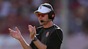 Aug 30, 2025; Los Angeles, California, USA; Southern California Trojans head coach Lincoln Riley watches from the sidelines against the Missouri State Bears in the first half at United Airlines Field at Los Angeles Memorial Coliseum. Mandatory Credit: Kirby Lee-Imagn Images