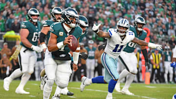 Nov 5, 2023; Philadelphia, Pennsylvania, USA; Philadelphia Eagles quarterback Jalen Hurts (1) runs away from pressure by Dallas Cowboys linebacker Micah Parsons (11) during the first quarter at Lincoln Financial Field. Mandatory Credit: Eric Hartline-Imagn Images