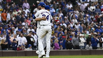 Sep 28, 2024; Chicago, Illinois, USA;  Chicago Cubs outfielder Cody Bellinger (24) hugs third baseman Isaac Paredes (17) after a game against the Cincinnati Reds at Wrigley Field.