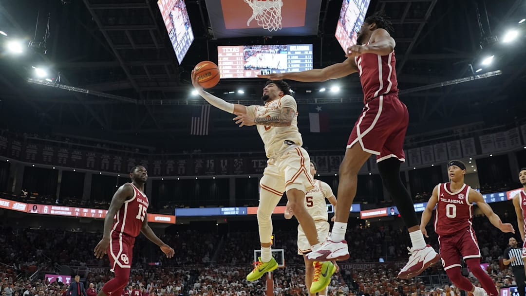 Mar 8, 2025; Austin, Texas, USA; Texas Longhorns guard Jordan Pope (0) drives to the basket against Oklahoma Sooners guard Duke Miles (15) during the second half at Moody Center. Mandatory Credit: Scott Wachter-Imagn Images Mar 8, 2025; Austin, Texas, USA; Texas Longhorns guard Jordan Pope (0) drives to the basket against Oklahoma Sooners guard Duke Miles (15) during the second half at Moody Center. Mandatory Credit: Scott Wachter-Imagn Images