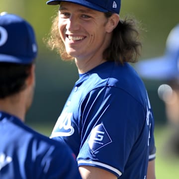 Feb 17, 2024; Glendale, AZ, USA;  Los Angeles Dodgers starting pitcher Tyler Glasnow (31) talks with relief pitcher Joe Kelly (99) during spring training at Camelback Ranch.