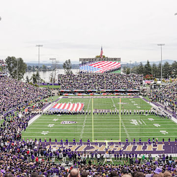 Husky Stadium is shown at full capacity for the national anthem.