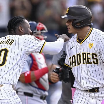 San Diego Padres third baseman Manny Machado (13) celebrates with left fielder Jurickson Profar (10) after hitting a two-run home run against the Washington Nationals during the first inning at Petco Park on June 25.