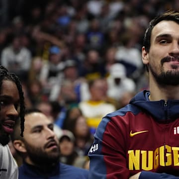 Feb 3, 2025; Denver, Colorado, USA; Denver Nuggets forward Dario Saric (9) on the bench in the second half against the New Orleans Pelicans at Ball Arena. Mandatory Credit: Ron Chenoy-Imagn Images