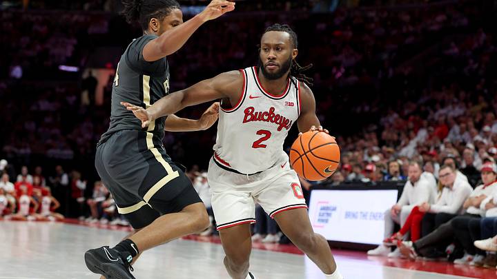 Mar 1, 2026; Columbus, Ohio, USA; Ohio State Buckeyes guard Bruce Thornton (2)  controls the ball as Purdue Boilermakers guard Gicarri Harris (24) defends during the second half at Value City Arena. Mandatory Credit: Joseph Maiorana-Imagn Images