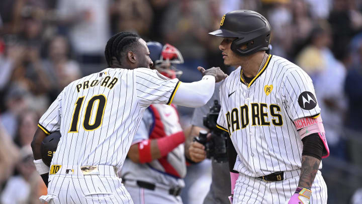 San Diego Padres third baseman Manny Machado (13) celebrates with left fielder Jurickson Profar (10) after hitting a two-run home run against the Washington Nationals during the first inning at Petco Park on June 25.