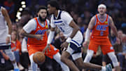 Nov 26, 2025; Oklahoma City, Oklahoma, USA; Minnesota Timberwolves forward Jaden McDaniels (3) moves around Oklahoma City Thunder guard Kenrich Williams (34) during the second quarter at Paycom Center. Mandatory Credit: Alonzo Adams-Imagn Images
