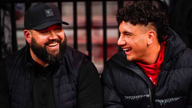 Nebraska Cornhuskers football assistant coach Donovan Raiola (left) and Dylan Raiola