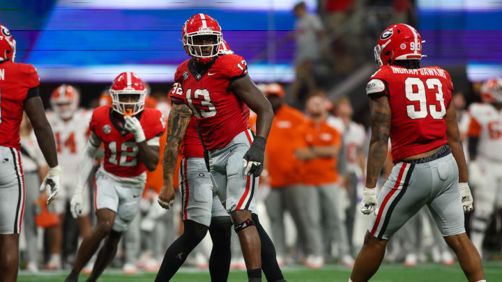 Aug 31, 2024; Atlanta, Georgia, USA; Georgia Bulldogs defensive lineman Mykel Williams (13) celebrates after a tackle against the Clemson Tigers in the third quarter at Mercedes-Benz Stadium. Mandatory Credit: Brett Davis-USA TODAY Sports