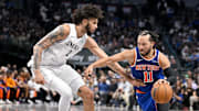 Nov 27, 2024; Dallas, Texas, USA; New York Knicks guard Jalen Brunson (11) drives to the basket past Dallas Mavericks center Dereck Lively II (2) during the second half at the American Airlines Center. Mandatory Credit: Jerome Miron-Imagn Images