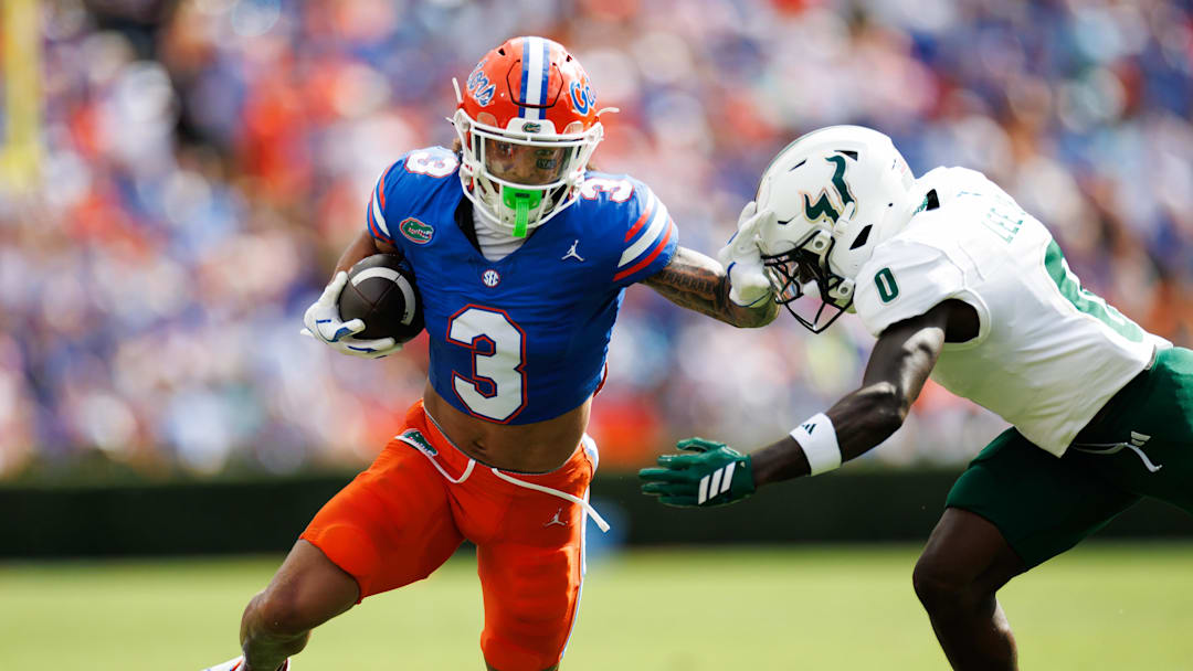 Sep 6, 2025; Gainesville, Florida, USA; Florida Gators wide receiver Eugene Wilson III (3) runs against South Florida Bulls cornerback Jarvis Lee (0) during the first half at Ben Hill Griffin Stadium. Mandatory Credit: Matt Pendleton-Imagn Images