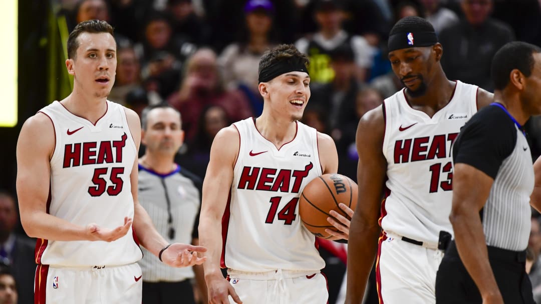 Dec 31, 2022; Salt Lake City, Utah, USA; Miami Heat forward Duncan Robinson (55), center/forward Bam Adebayo (13), and guard Tyler Herro (14) react after a call against the Utah Jazz during the second half at Vivint Arena. Mandatory Credit: Christopher Creveling-USA TODAY Sports