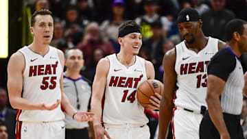 Dec 31, 2022; Salt Lake City, Utah, USA; Miami Heat forward Duncan Robinson (55), center/forward Bam Adebayo (13), and guard Tyler Herro (14) react after a call against the Utah Jazz during the second half at Vivint Arena. Mandatory Credit: Christopher Creveling-Imagn Images