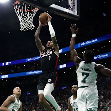 Mar 5, 2025; Boston, Massachusetts, USA; Portland Trail Blazers guard Anfernee Simons (1) goes to the basket past Boston Celtics guard Jaylen Brown (7) during the second half at TD Garden. Mandatory Credit: Winslow Townson-Imagn Images