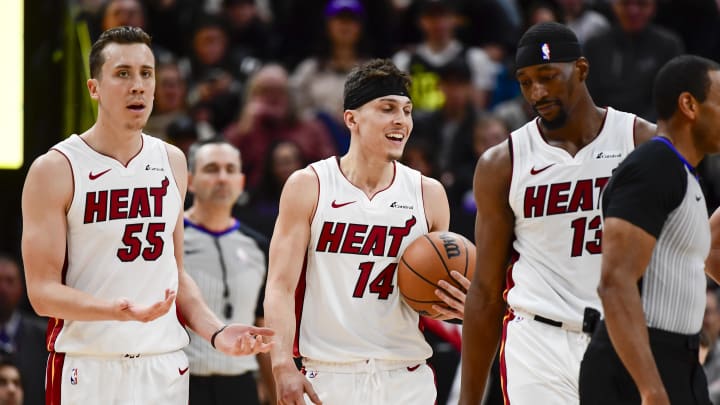 Dec 31, 2022; Salt Lake City, Utah, USA; Miami Heat forward Duncan Robinson (55), center/forward Bam Adebayo (13), and guard Tyler Herro (14) react after a call against the Utah Jazz during the second half at Vivint Arena. Mandatory Credit: Christopher Creveling-USA TODAY Sports