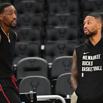 Oct 30, 2023; Milwaukee, Wisconsin, USA; Miami Heat center Bam Adebayo (13) greets Milwaukee Bucks guard Damian Lillard (0) before the game at Fiserv Forum. Mandatory Credit: Benny Sieu-Imagn Images