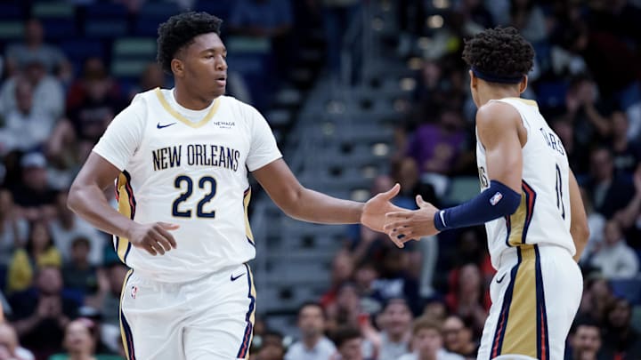 Dec 26, 2025; New Orleans, Louisiana, USA;  New Orleans Pelicans center Derik Queen (22) celebrates a basket with guard Jeremiah Fears (0) during the first half against the Phoenix Suns at Smoothie King Center. Mandatory Credit: Matthew Hinton-Imagn Images