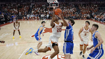 Feb 15, 2025; Austin, Texas, USA; Texas Longhorns guard Tre Johnson (20) drives to the basket against Kentucky Wildcats forward Trent Noah (9) during the second half at Moody Center. Mandatory Credit: Scott Wachter-Imagn Images