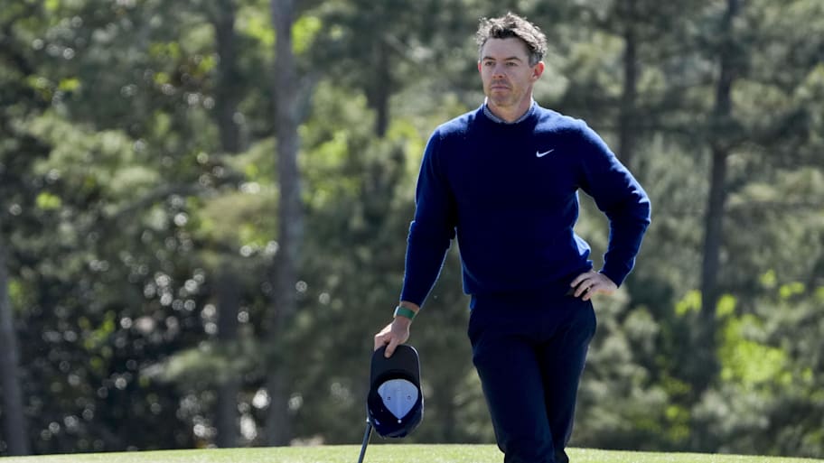 Rory McIlroy stands on the 18th green during the first round of the Masters 