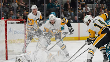 Jan 27, 2025; San Jose, California, USA;  Pittsburgh Penguins center Noel Acciari (55), defenseman Erik Karlsson (65) and left winger Bokondji Imama (14) look for the puck as Pittsburgh Penguins goalie Alex Nedeljkovic (39) defends the goal in the second period at SAP Center at San Jose. Mandatory Credit: David Gonzales-Imagn Images