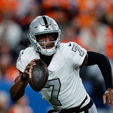 Nov 6, 2025; Denver, Colorado, USA; Las Vegas Raiders quarterback Geno Smith (7) scrambles with the ball in the fourth quarter against the Denver Broncos at Empower Field at Mile High. Mandatory Credit: Isaiah J. Downing-Imagn Images