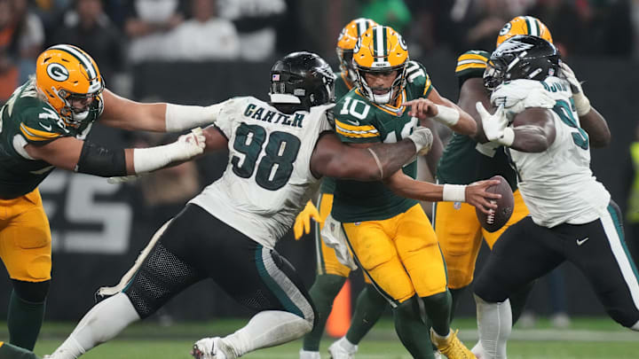 Sep 6, 2024; Sao Paulo, BRA; Green Bay Packers quarterback Jordan Love (10) is pressured by Philadelphia Eagles defensive tackle Jalen Carter (98) during the second half at Neo Quimica Arena. Mandatory Credit: Kirby Lee-Imagn Images