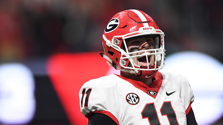 Dec 2, 2017; Atlanta, GA, USA; Georgia Bulldogs quarterback Jake Fromm (11) reacts after a score against the Auburn Tigers during the fourth quarter of the SEC Championship game at Mercedes-Benz Stadium. Mandatory Credit: John David Mercer-Imagn Images Dec 2, 2017; Atlanta, GA, USA; Georgia Bulldogs quarterback Jake Fromm (11) reacts after a score against the Auburn Tigers during the fourth quarter of the SEC Championship game at Mercedes-Benz Stadium. Mandatory Credit: John David Mercer-Imagn Images