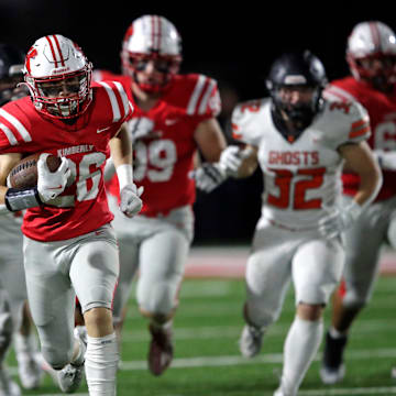 Kimberly High School's Kegan Pleau (26) runs for a long gain in the second quarter against Kaukauna High School during their football game Friday, October 11, 2024, in Kimberly, Wisconsin. Kimberly won 38-20.
