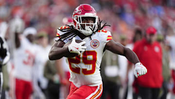 Nov 16, 2025; Denver, Colorado, USA; Kansas City Chiefs running back Kareem Hunt (29) carries the ball in the third quarter against the Denver Broncos at Empower Field at Mile High. Mandatory Credit: Ron Chenoy-Imagn Images