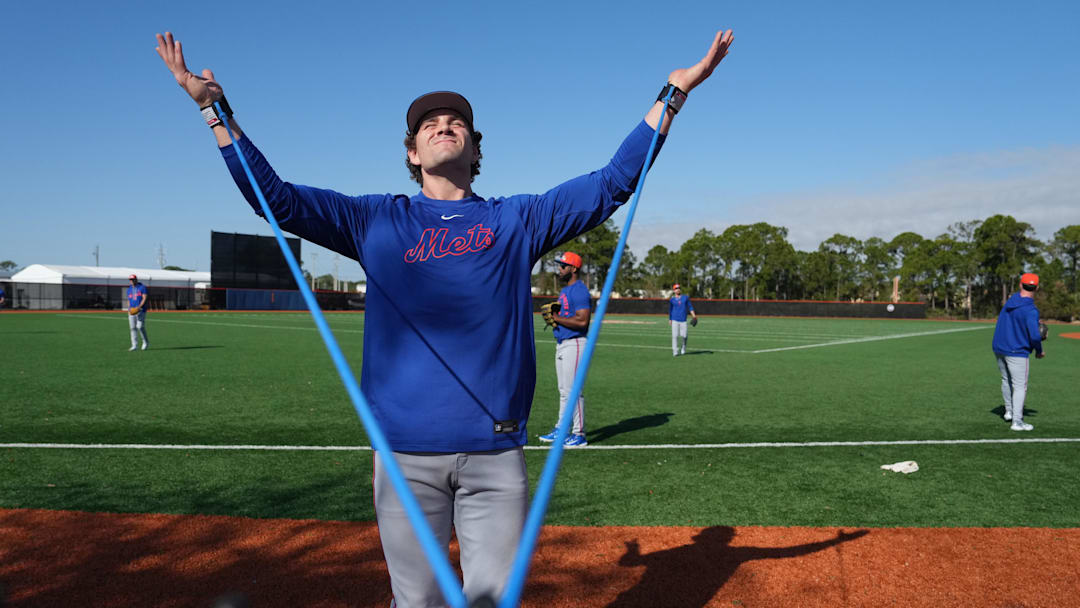 Feb 12, 2026; Port St. Lucie, FL, USA;  New York Mets pitcher Ryan Lambert stretches during spring training. Mandatory Credit: Jim Rassol-Imagn Images