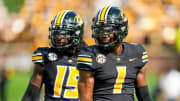 Missouri Tigers defensive back Jaylon Carlies (1) and defensive lineman Johnny Walker Jr. (15) react during the second half against the Tennessee Volunteers at Faurot Field at Memorial Stadium.