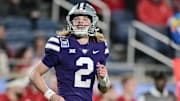 Kansas State quarterback Avery Johnson (2) smiles during the 2023 Pop-Tarts Bowl in Orlando, Fla., on Thursday, Dec. 28, 2023, at Camping World Stadium. Mandatory Credit: Julio Aguilar/Getty Images