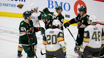 Apr 26, 2025; Saint Paul, Minnesota, USA; Minnesota Wild defenseman Jared Spurgeon (46) takes a punch from Vegas Golden Knights defenseman Alex Pietrangelo (7) during 1st OT in game four of the first round of the 2025 Stanley Cup Playoffs at Xcel Energy Center. Mandatory Credit: Bruce Fedyck-Imagn Images