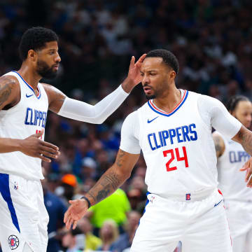 Apr 28, 2024; Dallas, Texas, USA;  LA Clippers guard Terance Mann (14) and LA Clippers forward Paul George (13) and LA Clippers guard Norman Powell (24) react  during the first quarter against the Dallas Mavericks during game four of the first round for the 2024 NBA playoffs at American Airlines Center. Mandatory Credit: Kevin Jairaj-USA TODAY Sports