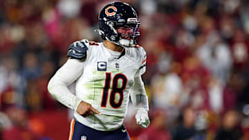 Oct 27, 2024; Landover, Maryland, USA; Chicago Bears quarterback Caleb Williams (18) celebrates after the Bears scored a touchdown during the fourth quarter against the Washington Commanders at Commanders Field. Mandatory Credit: Peter Casey-Imagn Images