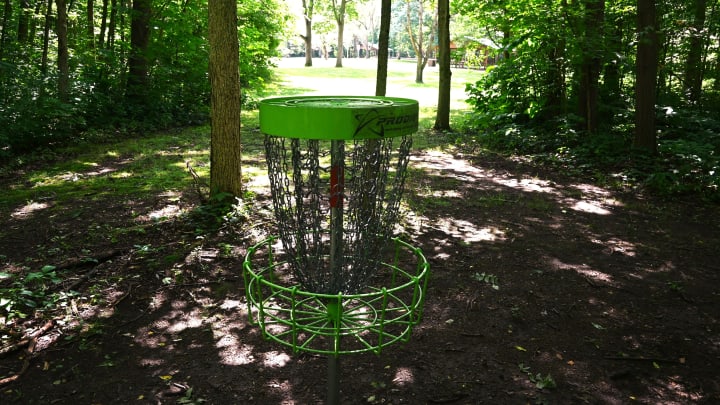 Disc golf baskets are tucked along the wooded trails along the Coldwater River in River Bend Park.