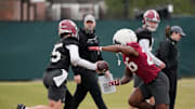 Mar 5, 2025; Tuscaloosa, AL, USA; Quarterback Ty Simpson (15) hands off to running back Jam Miller (26) during Spring Practice for the Crimson Tide.
