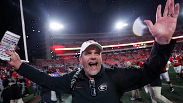 Georgia Offensive Coordinator Mike Bobo celebrates after wining a NCAA college football game against Ole Miss in Athens, Ga., on Saturday, Nov. 11, 2023. Georgia won 52-17.