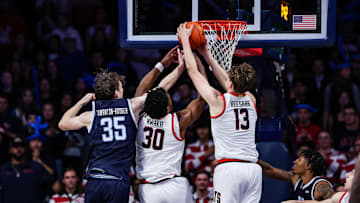 Nov 9, 2024; Tucson, Arizona, USA; Old Dominion Monarchs forward Caelum Swanton-Rodger (35), Arizona Wildcats forward Tobe Awaka (30) and Arizona Wildcats forward Henri Veesaar (13) all reach for the rebound during the second half at McKale Center. Mandatory Credit: Aryanna Frank-Imagn Images
