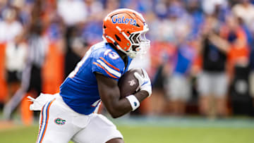 Sep 14, 2024; Gainesville, Florida, USA; Florida Gators running back Jadan Baugh (13) runs with the ball against the Texas A&M Aggies during the first half at Ben Hill Griffin Stadium. Mandatory Credit: Matt Pendleton-Imagn Images