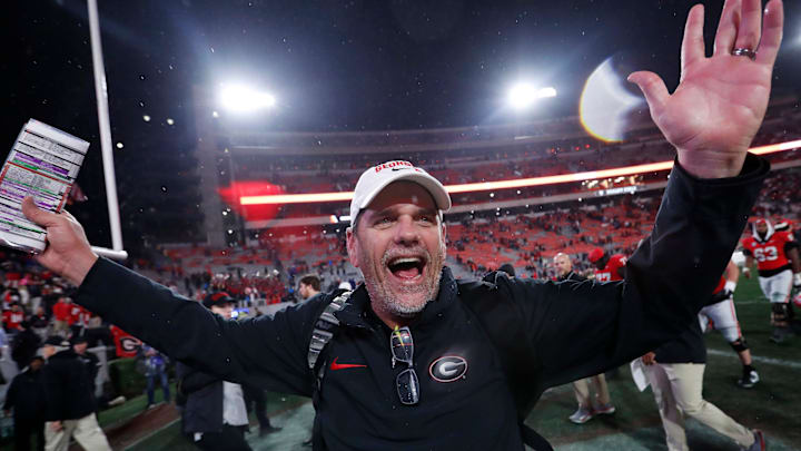Georgia Offensive Coordinator Mike Bobo celebrates after wining a NCAA college football game against Ole Miss in Athens, Ga., on Saturday, Nov. 11, 2023. Georgia won 52-17.