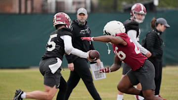 Mar 5, 2025; Tuscaloosa, AL, USA; Quarterback Ty Simpson (15) hands off to running back Jam Miller (26) during Spring Practice for the Crimson Tide.
