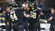 Nov 23, 2025; New Orleans, Louisiana, USA; New Orleans Saints defensive end Cameron Jordan (94) and defensive end Chris Rumph II (58) react after a defensive play against the Atlanta Falcons during the first half at Caesars Superdome. Mandatory Credit: Stephen Lew-Imagn Images