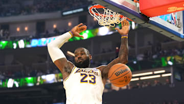 Los Angeles Lakers forward LeBron James dunks against the Golden State Warriors.