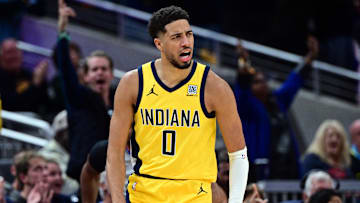 Oct 27, 2024; Indianapolis, Indiana, USA; Indiana Pacers guard Tyrese Haliburton (0) reacts to scoring points during overtime against the Philadelphia 76ers at Gainbridge Fieldhouse. Mandatory Credit: Marc Lebryk-Imagn Images