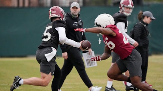 Mar 5, 2025; Tuscaloosa, AL, USA; Quarterback Ty Simpson (15) hands off to running back Jam Miller (26) during Spring Practice for the Crimson Tide.