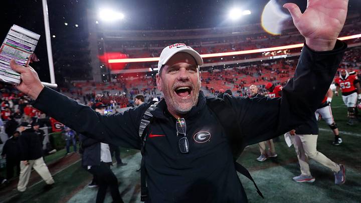 Georgia Offensive Coordinator Mike Bobo celebrates after wining a NCAA college football game against Ole Miss in Athens, Ga., on Saturday, Nov. 11, 2023. Georgia won 52-17.