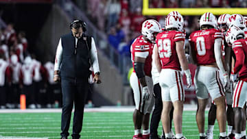 Oct 11, 2025; Madison, Wisconsin, USA; Wisconsin Badgers head coach Luke Fickell and his team take a timeout in the second half against the Iowa Hawkeyes at Camp Randall Stadium. Mandatory Credit: Ross Harried-Imagn Images